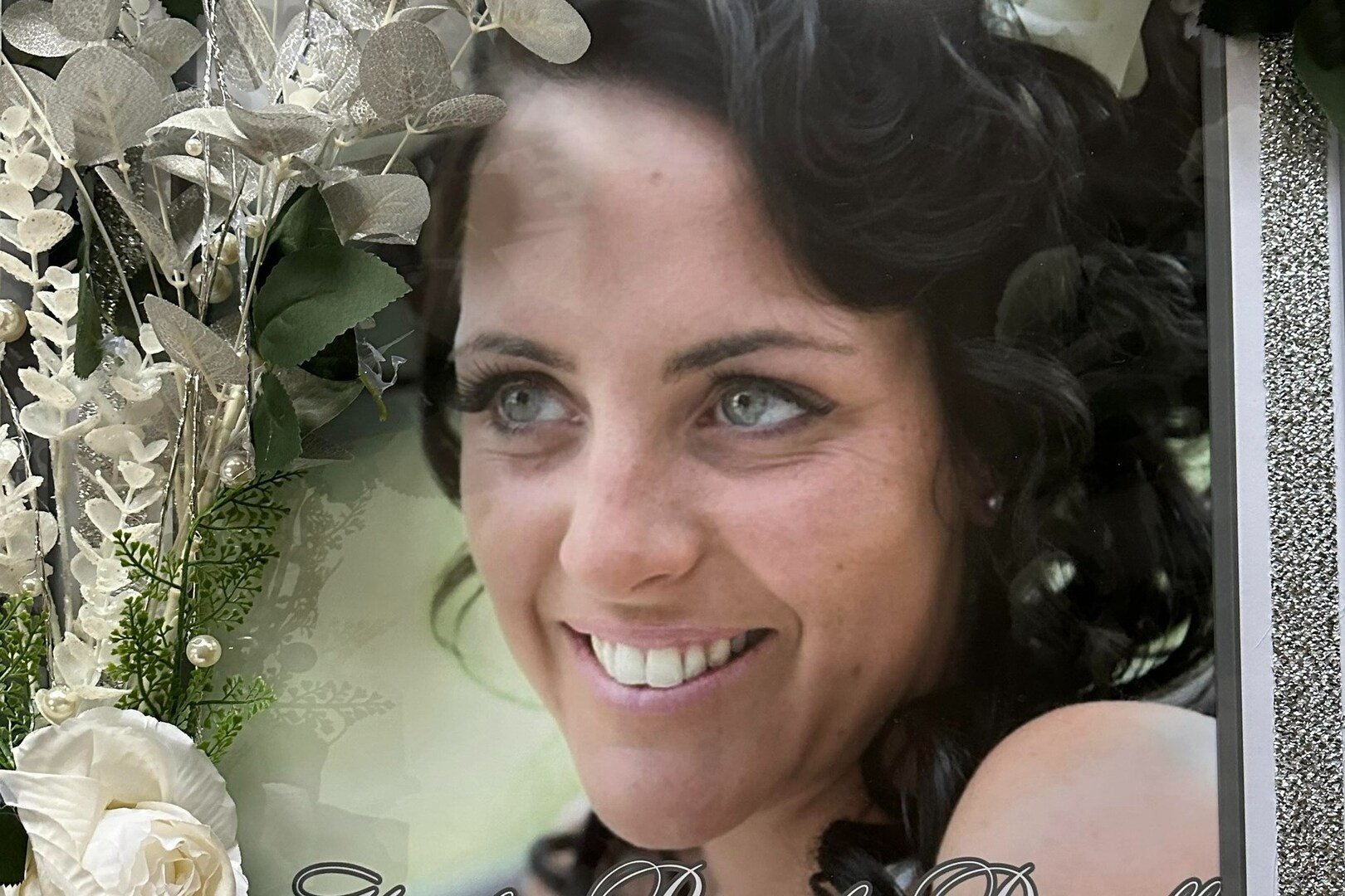 Framed photo of Hayley Pamela Dowell with white flowers.