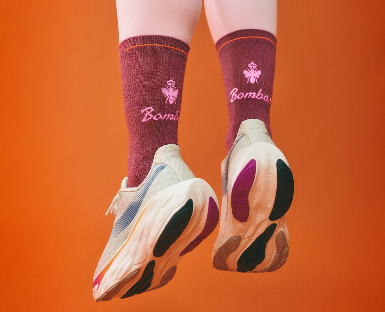 Legs in Bombas socks and sneakers.